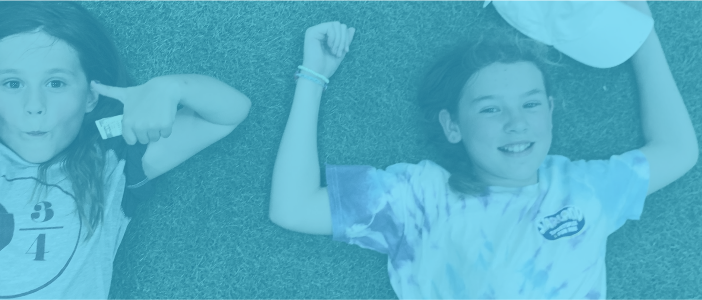kids lying in grass