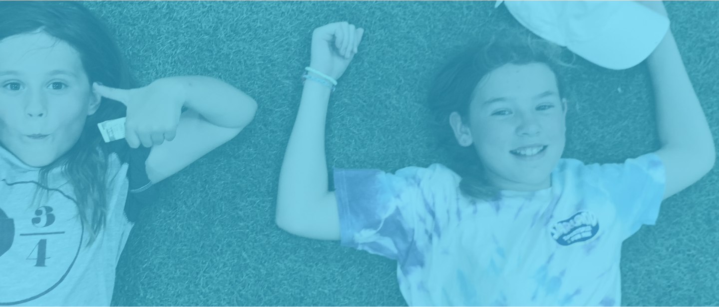 kids lying in grass